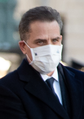 Man in a coat and face mask outdoors